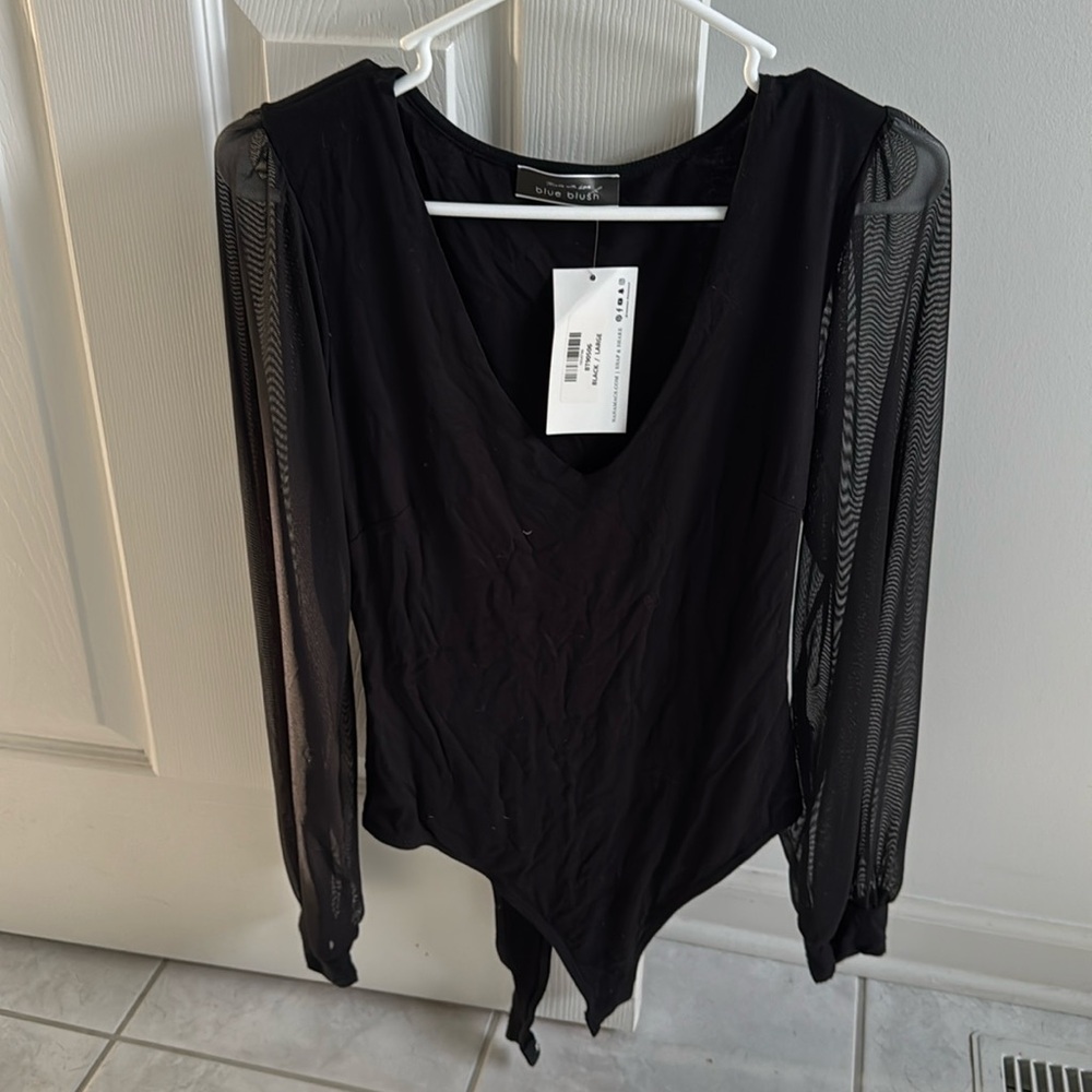 Black body suit with mesh arms size large. Brand new with tags!
